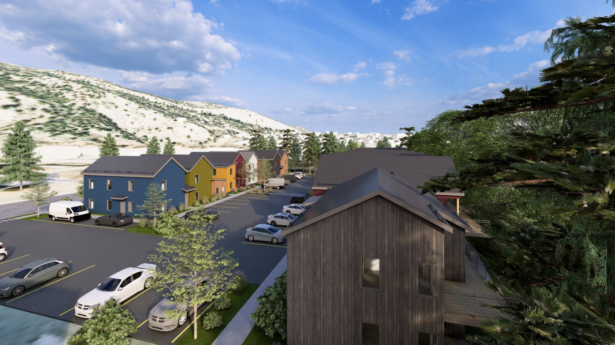 View of residential units with mountains and trees beyond